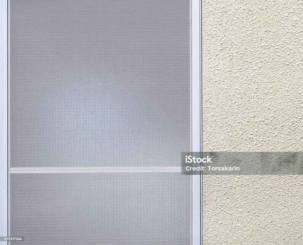 Window frosted glass Window frosted glass and white simple wall background 2015 Stock Photo