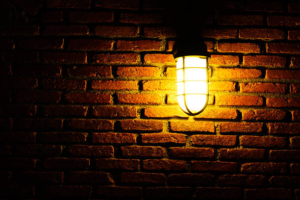 istock light bulb on vintage orange brick wall 474217304