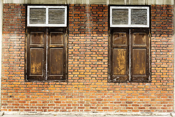istock Vintage wooden window on brick wall 474217306