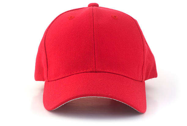 Red Baseball Cap Isolated red baseball cap on a white background. baseball cap stock pictures, royalty-free photos & images