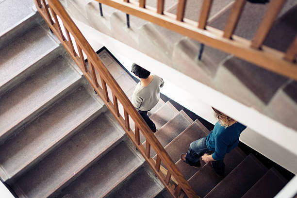 istock staircase with people 474221488