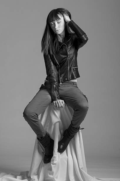 istock Attractive young woman in leather jacket and pants 474222819