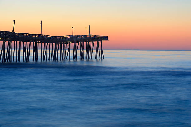 istock Fishing Pier and Smooth Ocean at Sunrise 474228810