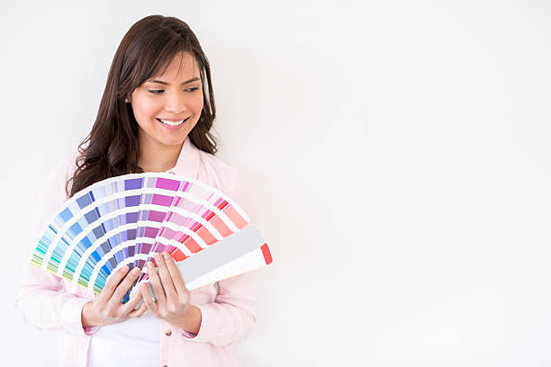 istock Woman painting a white wall 474229646