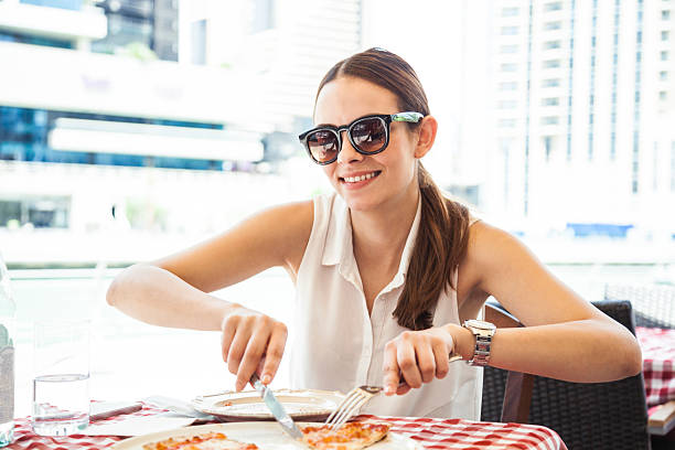 istock Friends eating Pizza in a sidewalk restaurant 474230030