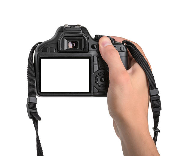dslr cámara en mano aislado - cámara réflex digital de objetivo único fotos fotografías e imágenes de stock