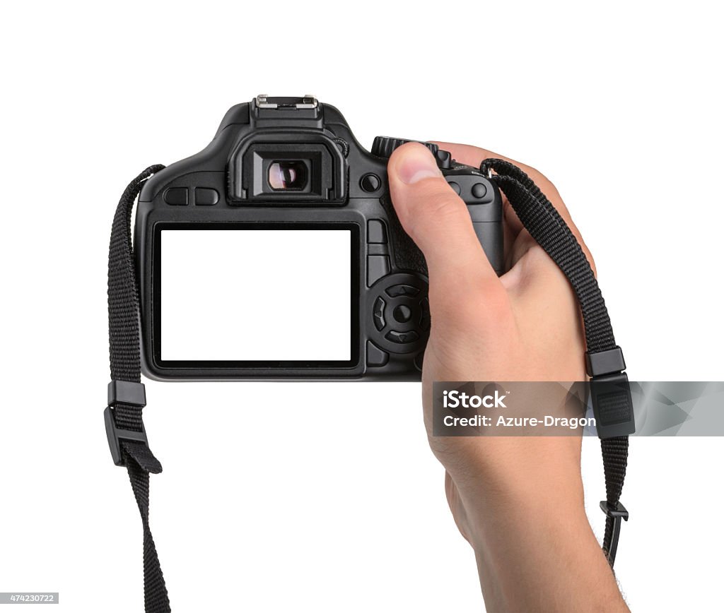 DSLR camera in hand isolated Camera - Photographic Equipment Stock Photo