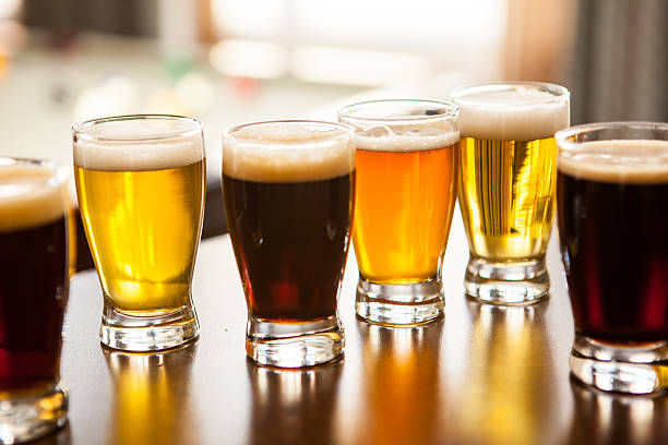 istock Six sample glasses of beer on a bar 474230848
