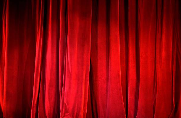 istock Part of a lighted red curtain 474233332