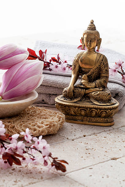 istock Buddha for zen attitude with flowers at spa 474233720