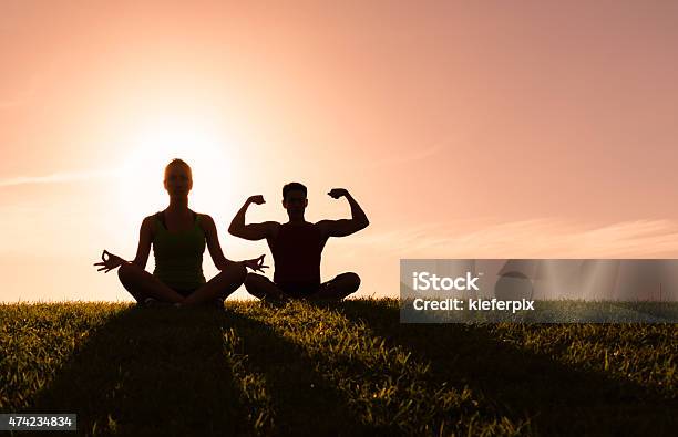 Couple Doing Yoga Outdoors Stock Photo - Download Image Now - 2015, Active Lifestyle, Activity