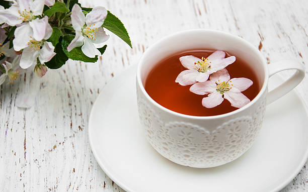 istock Cup of tea and spring blossom 474234974
