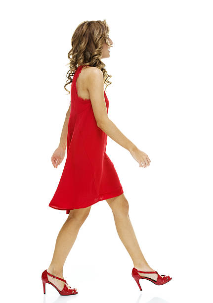 istock Smiling female walking and looking away 474235260