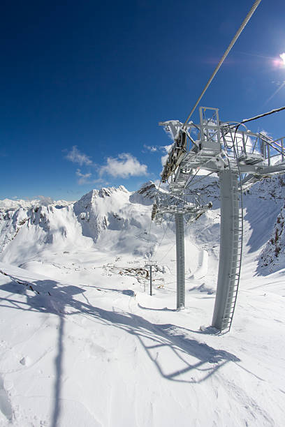 istock ski lift chairs in the mountains 474236363