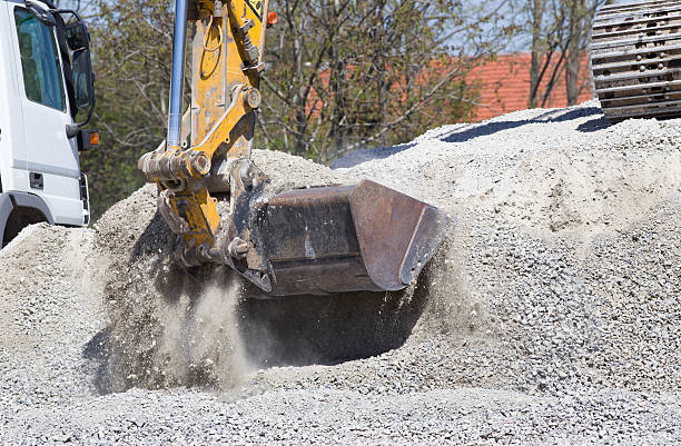 istock Excavator bucket with gravel 474236974