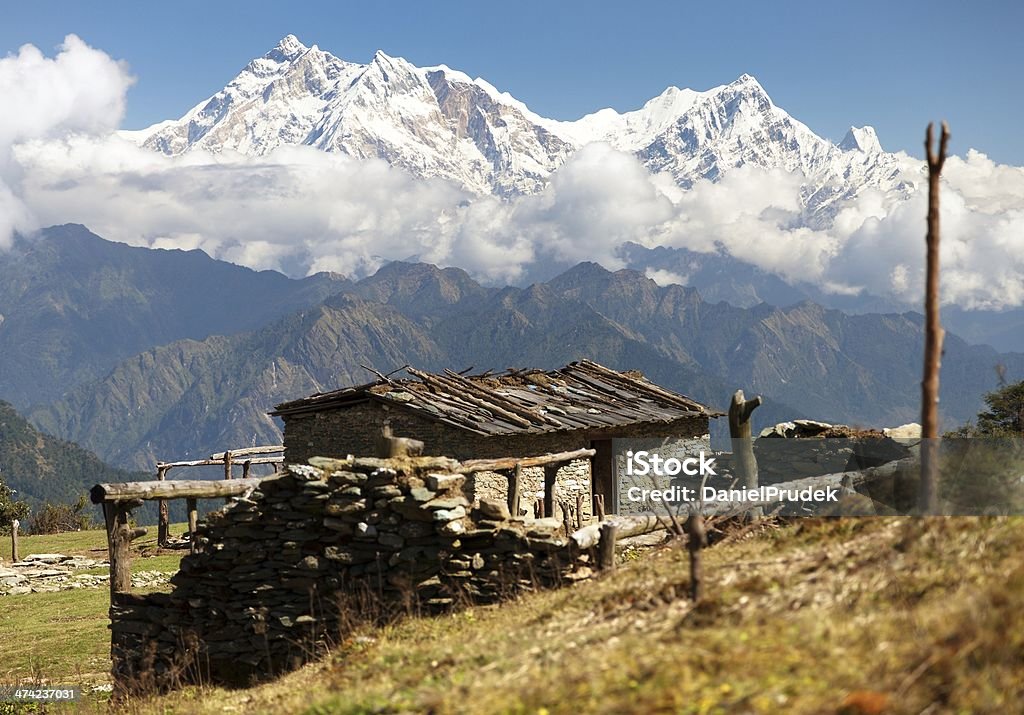 mount Annapurna - Nepal view from Jaljala pass with chalet on pastureland and mount Annapurna - Nepal Annapurna Conservation Area Stock Photo