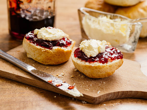 istock Two scones with clotted cream and jam 474238017