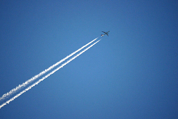 istock Contrails in the blue sky 474241135