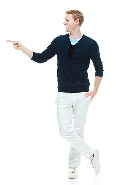 istock Smiling casual man pointing away 474242330