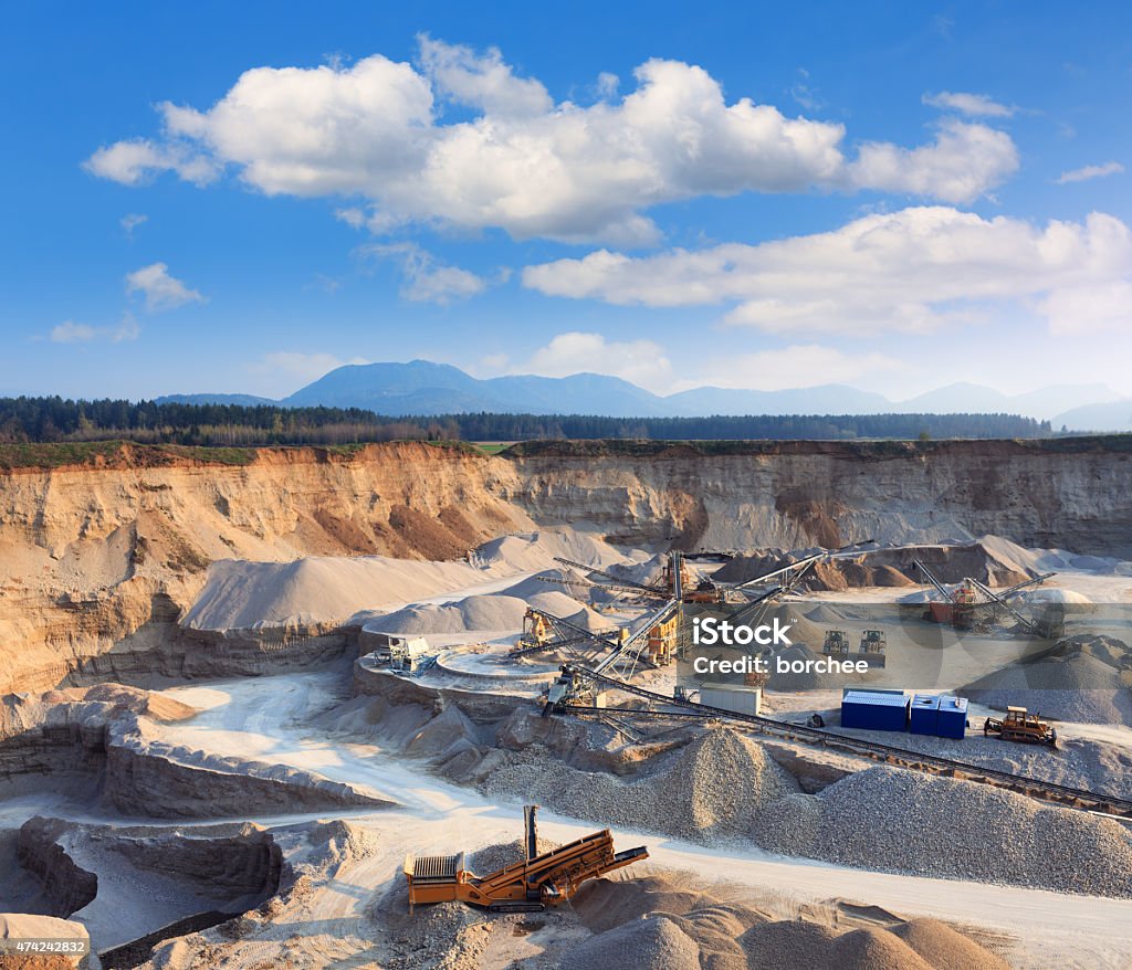 Rock Quarry Rock quarry with trucks and all equipment. Mining - Natural Resources Stock Photo