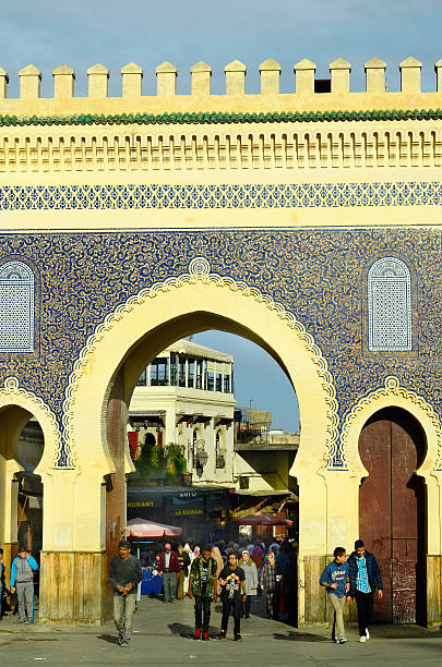 Morocco, Fes Fes, Morocco - November 20th 2014: Unidentified people at Bab Boujeloud the entrance to souk Fes el-Bali, a Unesco world heritage site bab boujeloud stock pictures, royalty-free photos & images