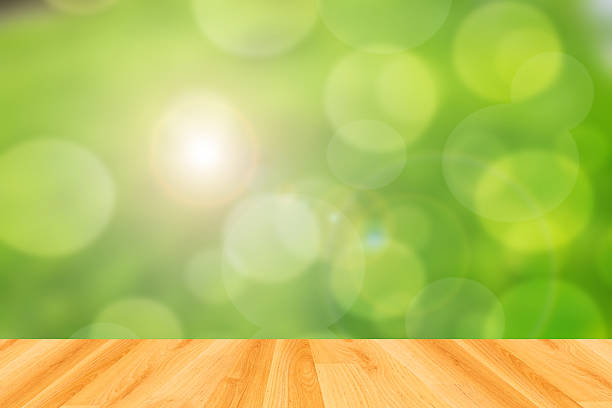 istock wood floor and abstract green bokeh background 474248956