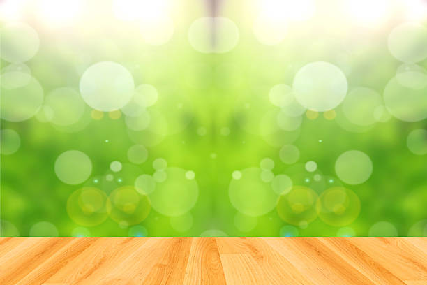 istock wood floor and abstract green bokeh background 474248958