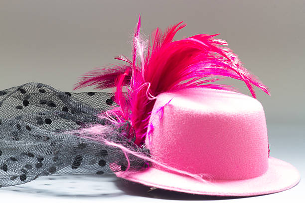istock Pink velvet hat and tassel on the table 474251794