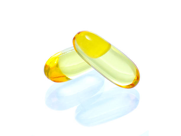 istock yellow vitamin omega3 fish oil capsule  on white background 474256662