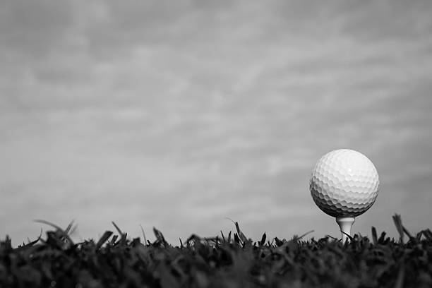 istock Black and white of golf ball on tee 474258982