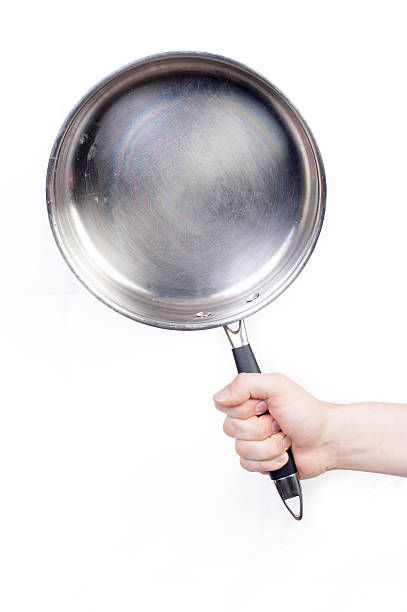istock Man holding a frying pan 474259370