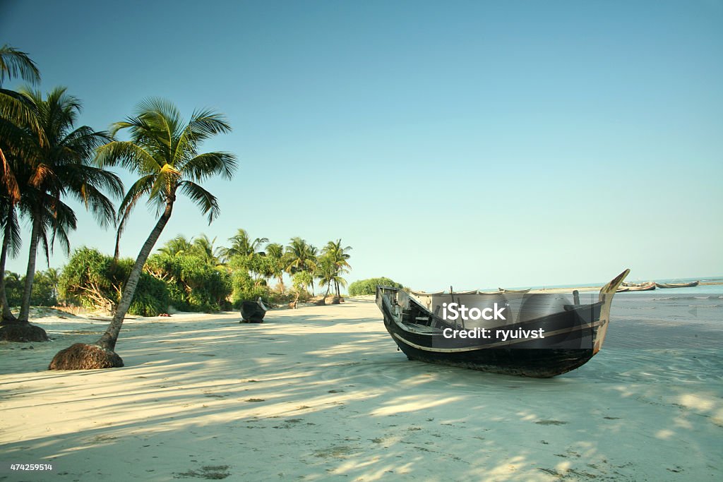 Boat on the tropical Beach Boat resting on a beach on St. Martins Island, Bangladesh Bangladesh Stock Photo