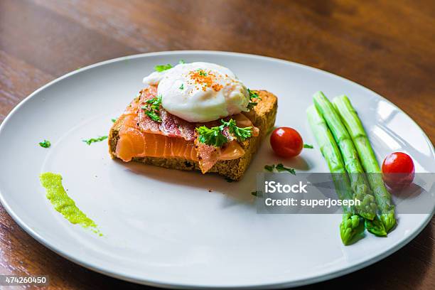 Sandwich With Poached Egg Parma Ham And Salmon Stock Photo - Download Image Now - 2015, Appetizer, Asparagus