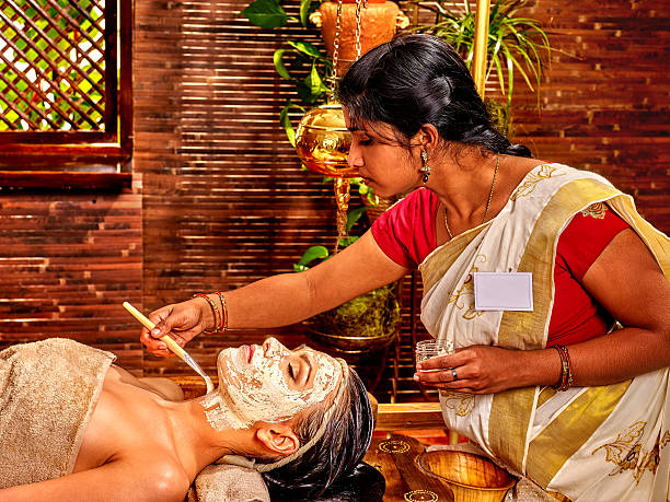 Woman having mask at ayurveda spa
