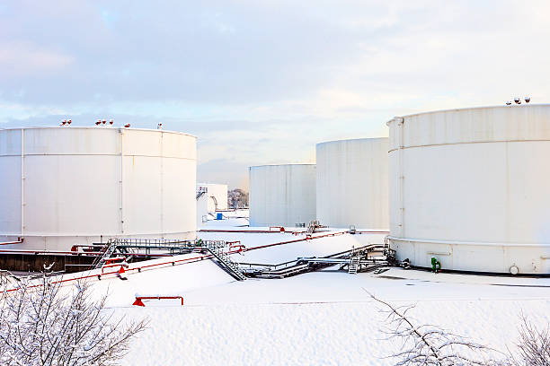 white tanks in tank farm with snow in winter