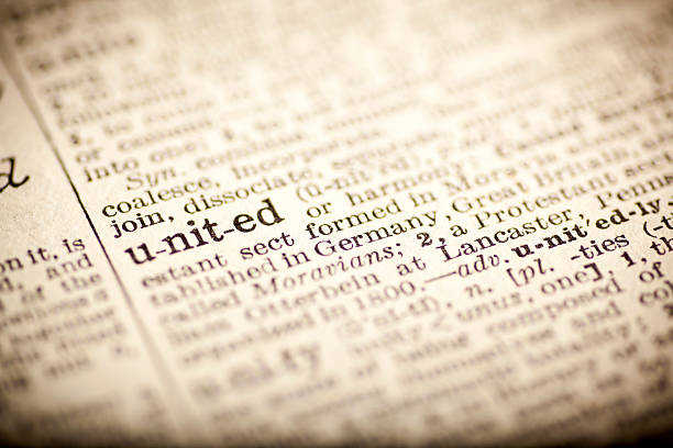 istock Old dictionary open on the word united 474264134