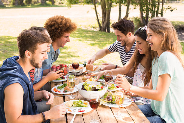 istock Happy friends in the park having lunch 474264718