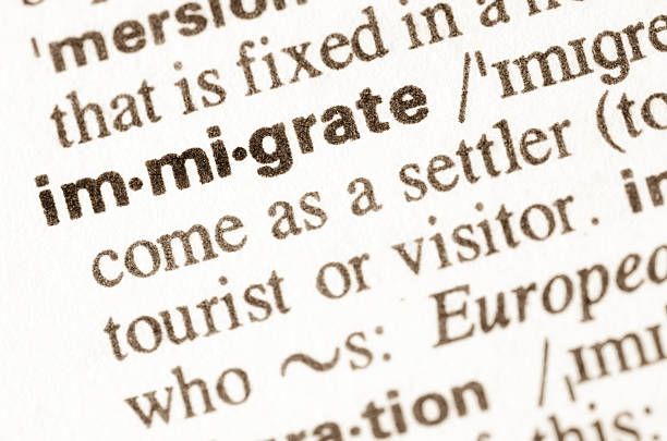 istock Dictionary definition of word immigrate 474264990