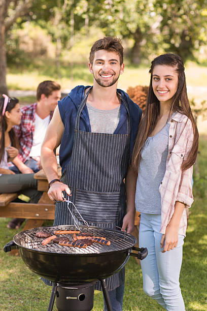 istock Happy friends in the park having barbecue 474265128
