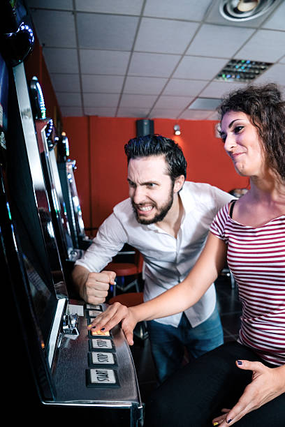istock Friends Playing The Slots 474267036