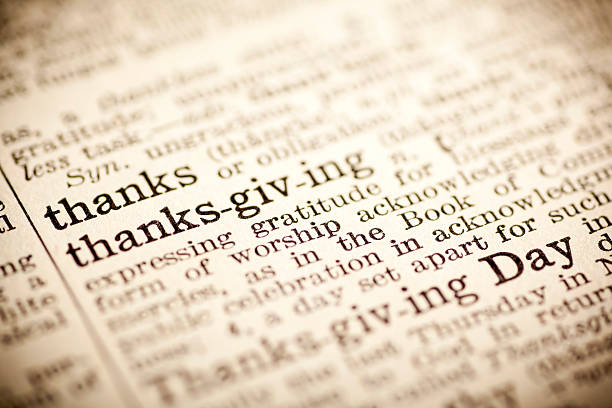 istock Old dictionary open on the word thanks giving 474268184