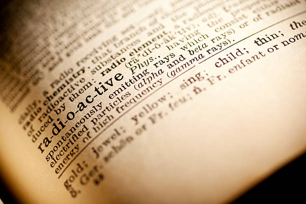 istock Old dictionary open on the word radioactive 474268192