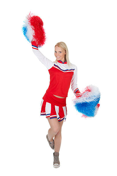 istock Smiling beautiful cheerleader with pompoms. 474272600