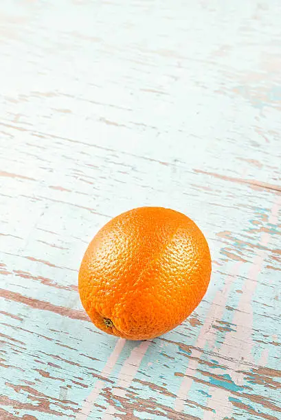 Fresh Ripe Sweet Orange Fruit on Rustic Grunge Blue Wood Background