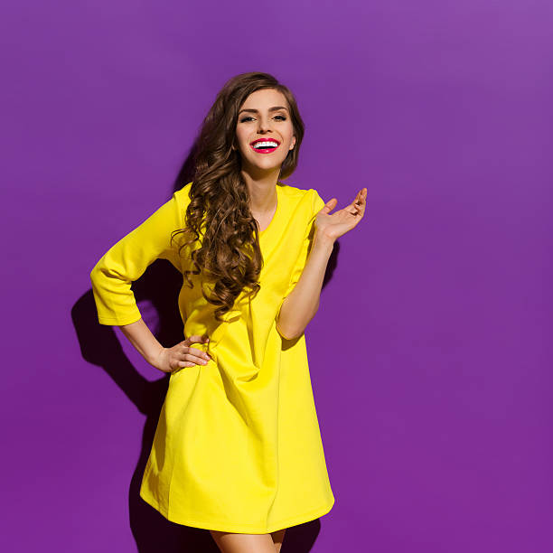 istock Smiling Girl on a Violet Background 474275594