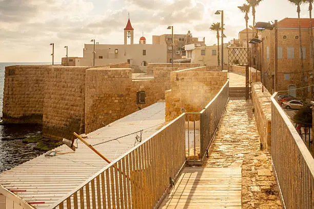 St. John the Baptist Franciscan church and the sea wall promenade, in the old city of Acre, Israel