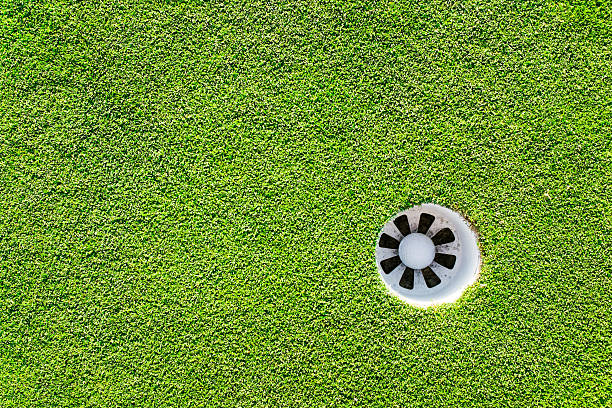 istock Golf Ball In The Hole 474283462