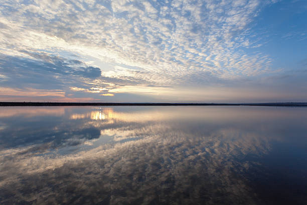 istock Landscape with lake reflection clouds. Beautiful summer sunset 474283586