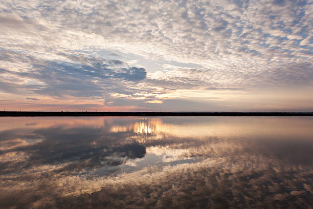 istock Landscape with lake reflection clouds. Beautiful summer sunset 474283594