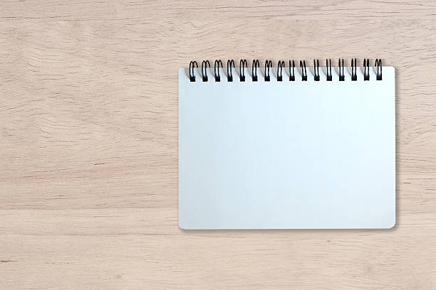 istock white page of notebook on wood texture 474291986